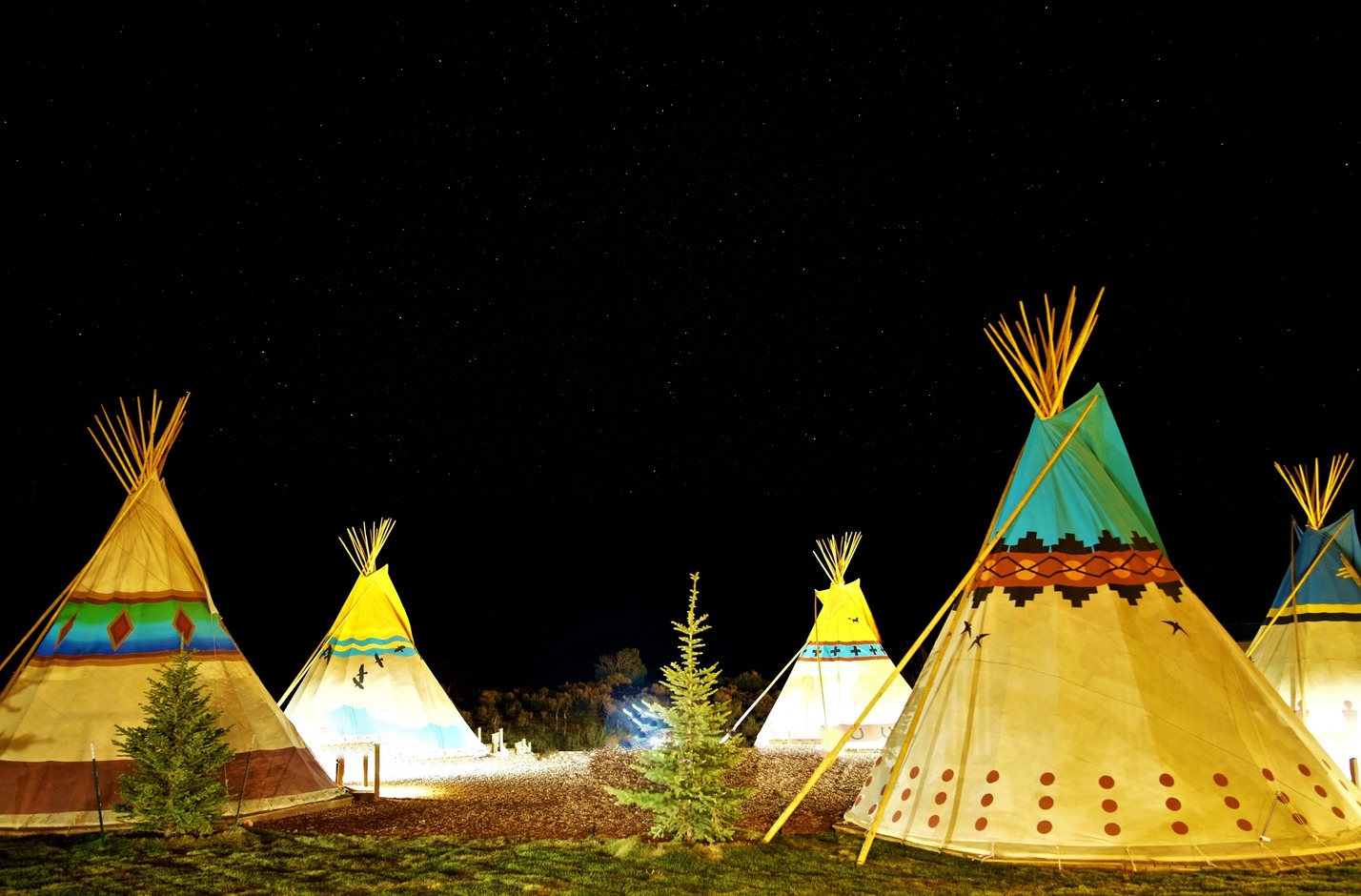 Large Teepee Tents Under Starry Sky